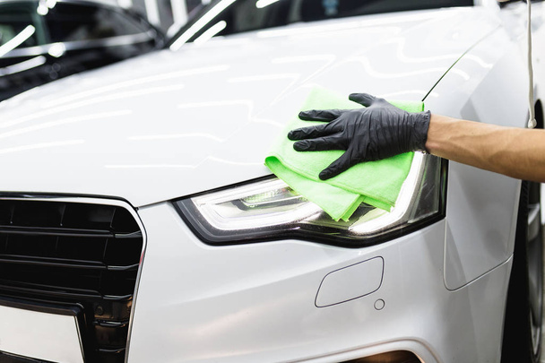 man cleaning car with microfiber cloth - Photo, Image