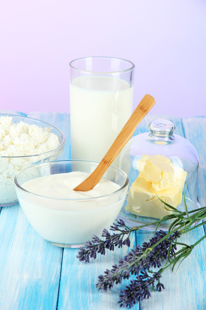 Glass of milk and cheese on light background - Photo, image