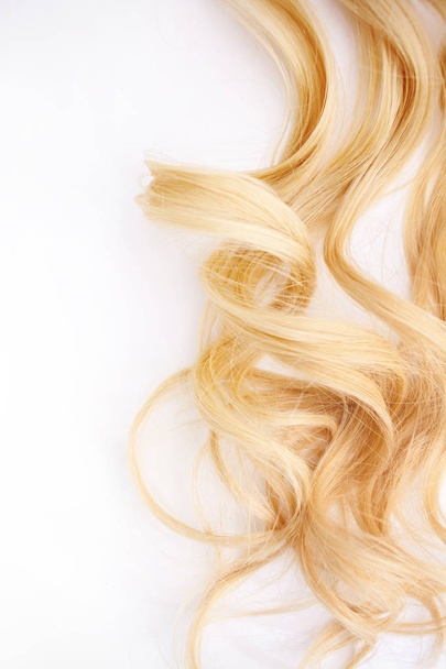 Golden Curls hair isolated on white background. strand of Blonde hair, hair care - Photo, Image