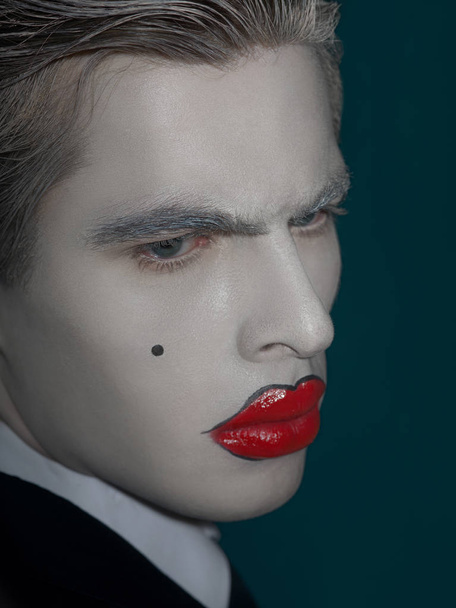 portrait of male model with white face and red lips - Фото, зображення