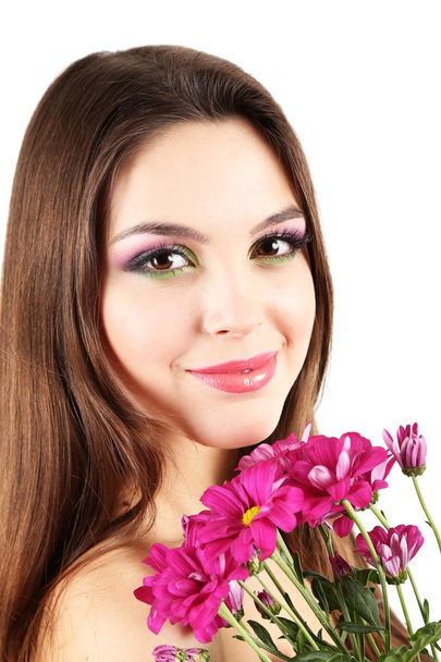 Young beautiful girl with nice flowers - Фото, зображення