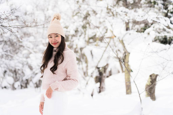 Portrait Young Beautiful asian woman smile happy travel and enjoy with snow winter season in Hokkaido Sapporo Japan - Photo, Image