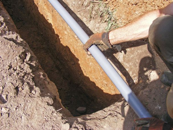 Montage of a overflow drainage by builder - Photo, Image