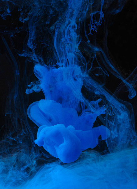 Blue ink in water on black background. - Φωτογραφία, εικόνα