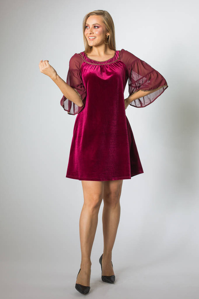 Blonde model posing in cherry-colour dress - Valokuva, kuva