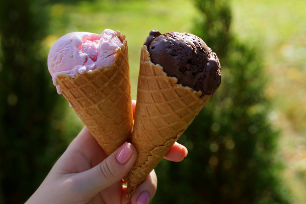 girl  hand holds ice cream in a waffle cup - Photo, Image