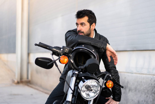 Young man on a motorbike - Photo, Image