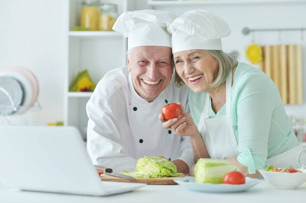 Senior couple at kitchen  - Фото, изображение