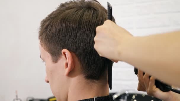 Female haircut with electric razor - Footage, Video