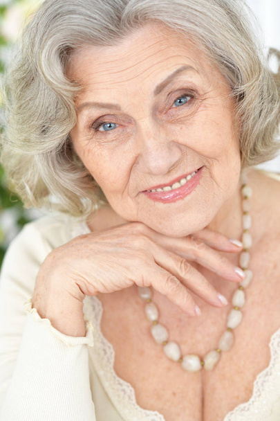 happy Senior woman portrait at home - 写真・画像