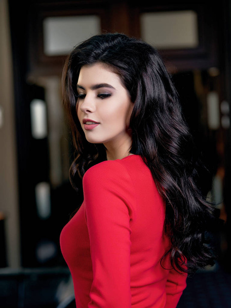side view of young beautiful model in red dress - Zdjęcie, obraz