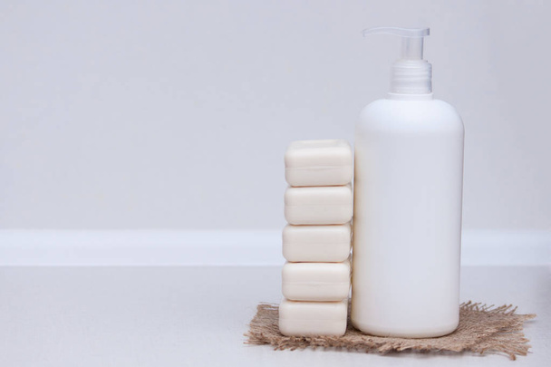 Liquid and soap bar on the white background. Copy space - Photo, Image