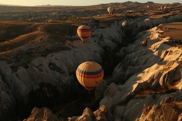 Turkey balloons Cappadocia Goreme Kapadokya , Sunrise in the mountains of Capadocia - Фото, изображение