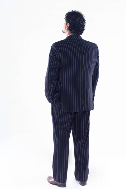 side view.confident businessman looking at copy space - Фото, изображение