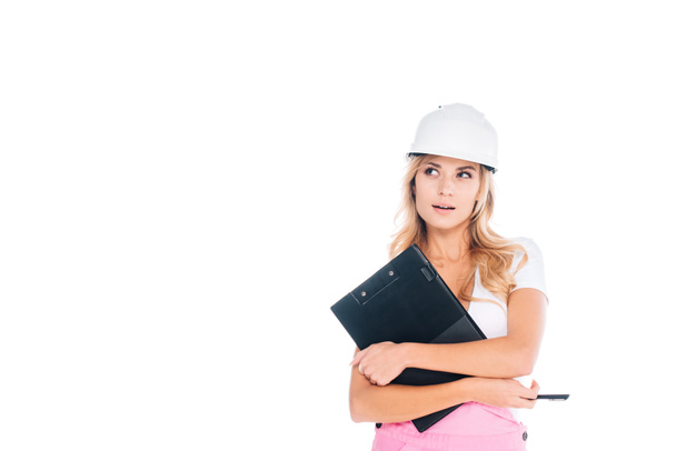 architect woman in pink uniform, hardhat with clipboard and pen isolated on white - 写真・画像