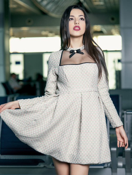 young brunette model posing in airport - Photo, Image