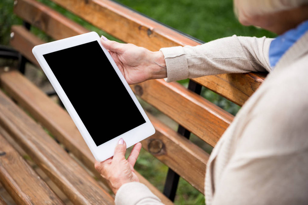 selective focus of digital tablet with blank screen in hands of senior woman - Photo, Image