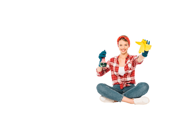 floating girl in jeans and plaid shirt with spray and rag isolated on white - Photo, Image