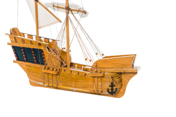 vintage wooden ship model floating in air isolated on white with copy space  - 写真・画像
