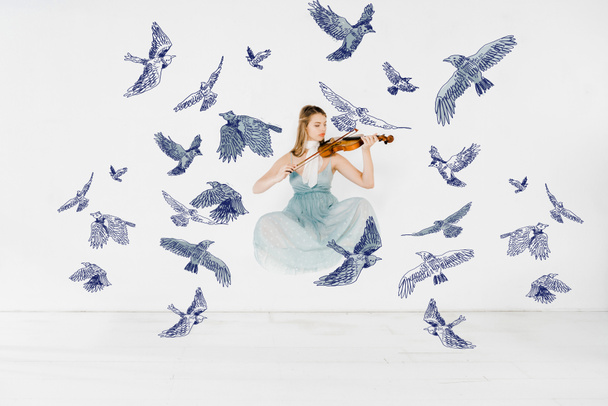 floating girl in blue dress playing violin with birds illustration - Photo, Image