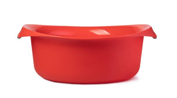 piros műanyag mosás tálba. Fehér háttér - Fotó, kép