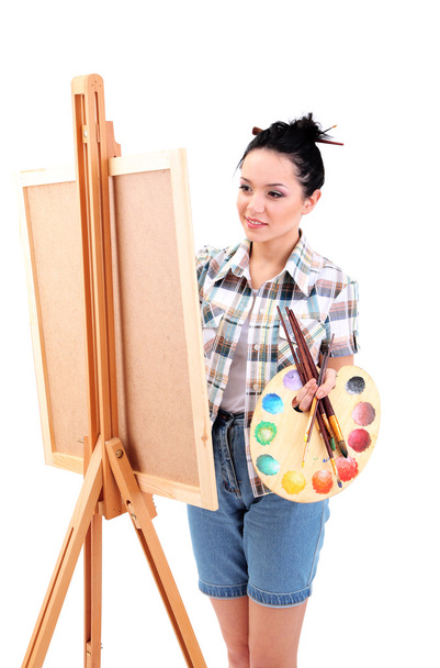 Beautiful young woman painter at work, isolated on white - 写真・画像