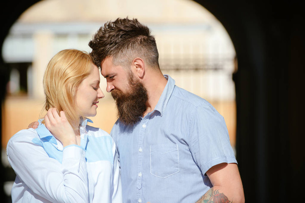 Quite moments together. Couple in love on summer day. Sensual woman and bearded man enjoy romantic date. Loving couple of woman and hipster dating outdoor. Feeling love and romance - Фото, изображение