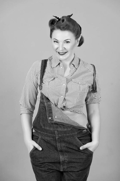 Brunette woman in denim on gray background. Girl with curls and head scarf in retro american worker style. Woman model isolated in studio. Happy woman in denim - Φωτογραφία, εικόνα