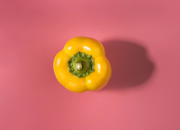 Natural organic yellow bulgarian bell pepper on trend pink background.Top view.Healthy food concept. Flat lay.Copy space. Minimalism style.Vegetables Vitamins Rustic Style. Country Village Agriculture - Fotoğraf, Görsel