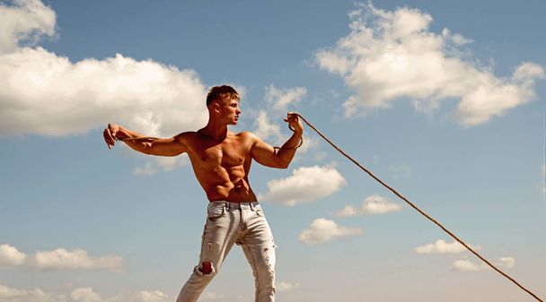 Big result requires big ambition. Sport exercises to build strength and power. Strong man pull rope. Sport man develop muscular hand strength. Athlete with fit sexy torso. Achieving ambition in sport - Photo, image