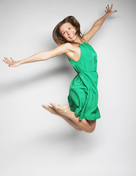 beautiful fairy flying girl in green dress  - Foto, Imagen