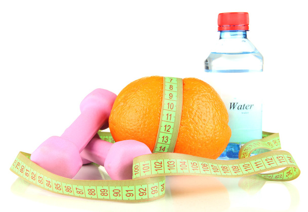 Orange with measuring tape, dumbbells and bottle of water - Foto, imagen