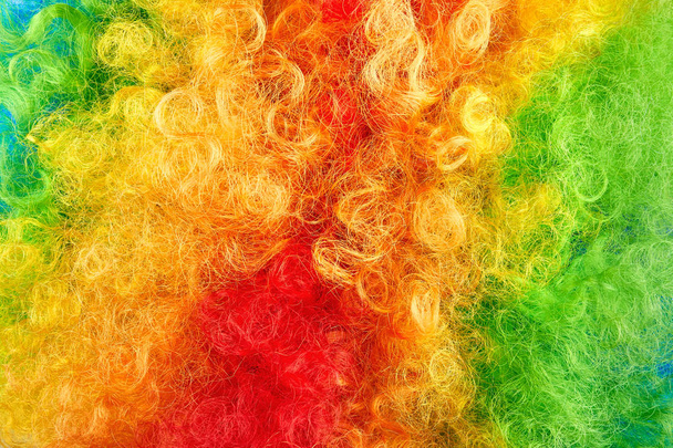 Close up photo of colorful hair. Red, green and yellow shaggy texture.  - Photo, Image