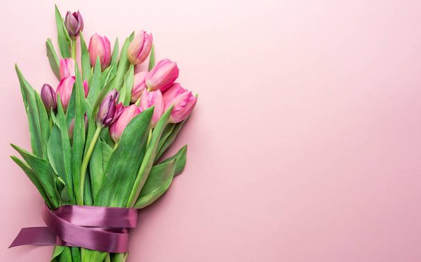 Bouquet pink tulips on lightpink background. Top view. - Φωτογραφία, εικόνα