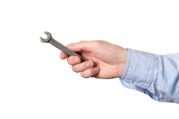 Wrench, spanner. Hand holding a metal wrench on white background - Valokuva, kuva