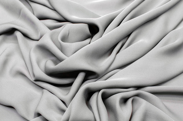 Cierre de tela de seda gris
 - Foto, imagen