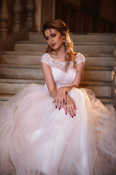 Beautiful blonde bride woman in a gorgeous wedding dress, fashion beauty portrait - 写真・画像