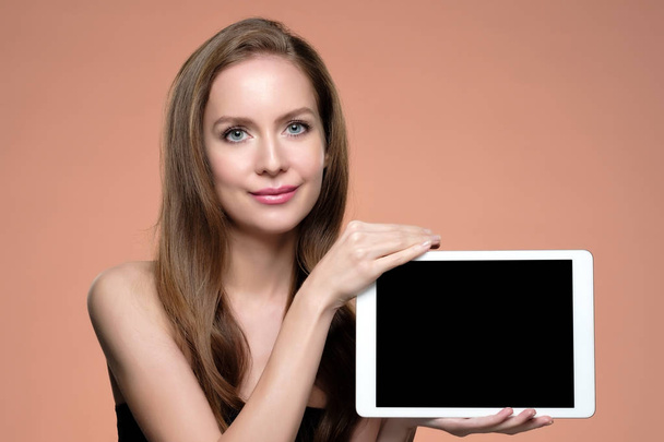 Beautiful girl with perfect make up holding tablet. Concept of cosmetics blogger - Foto, Imagen