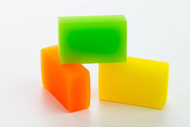 Three colored eraser for erasing pencil on white background - Φωτογραφία, εικόνα