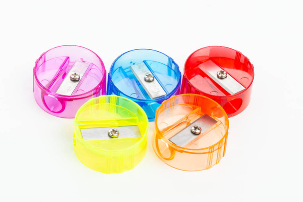 Five colorful plastic pencil sharpeners on white background - 写真・画像