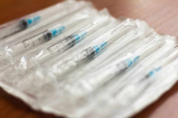 new disposable injection syringes in the package, close-up, selective focus - Photo, Image