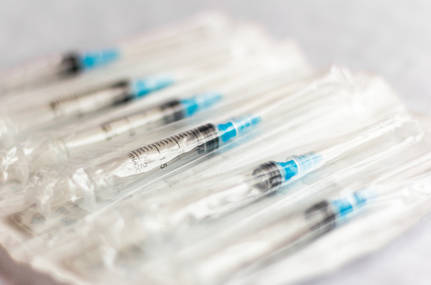 new disposable injection syringes in the package, close-up, selective focus - Photo, Image