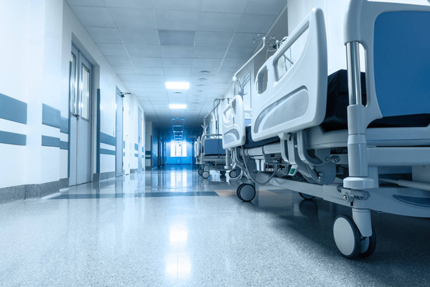 Long corridor in hospital with surgical transport. Tinted picture - Photo, image