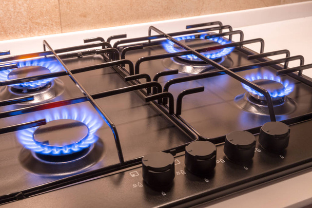 Gas burner on black modern kitchen stove - Photo, Image