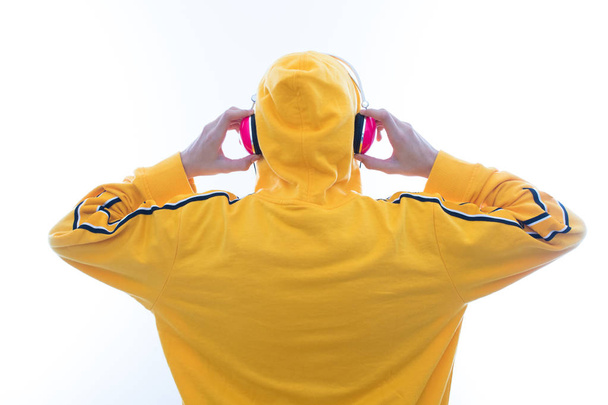young listening to music with headphones - Photo, Image