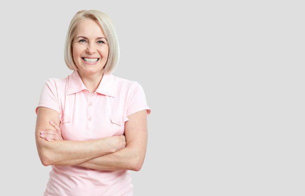 Friendly smiling middle-aged woman isolated on white background - Φωτογραφία, εικόνα