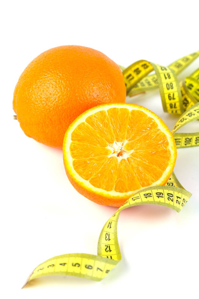 Orange Fruit with measurement isolated on white. Concept of dieting and body care - Foto, Imagem
