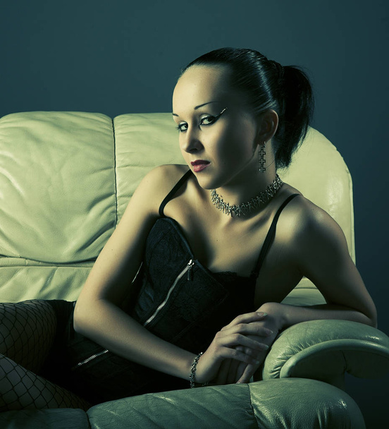 Portrait of sexy young model on sofa - Photo, image