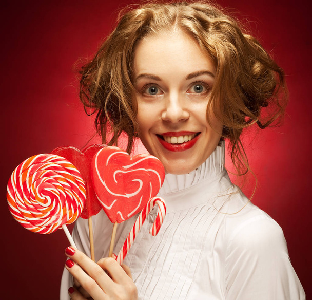 woman with heart caramel over red background  - Photo, image