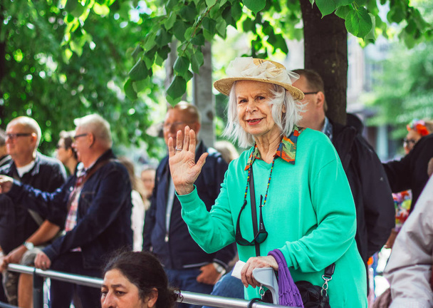 Helsinki, Finland - June 30, 2018: Aged woman on street on Helsinki pride festival - Foto, Imagen